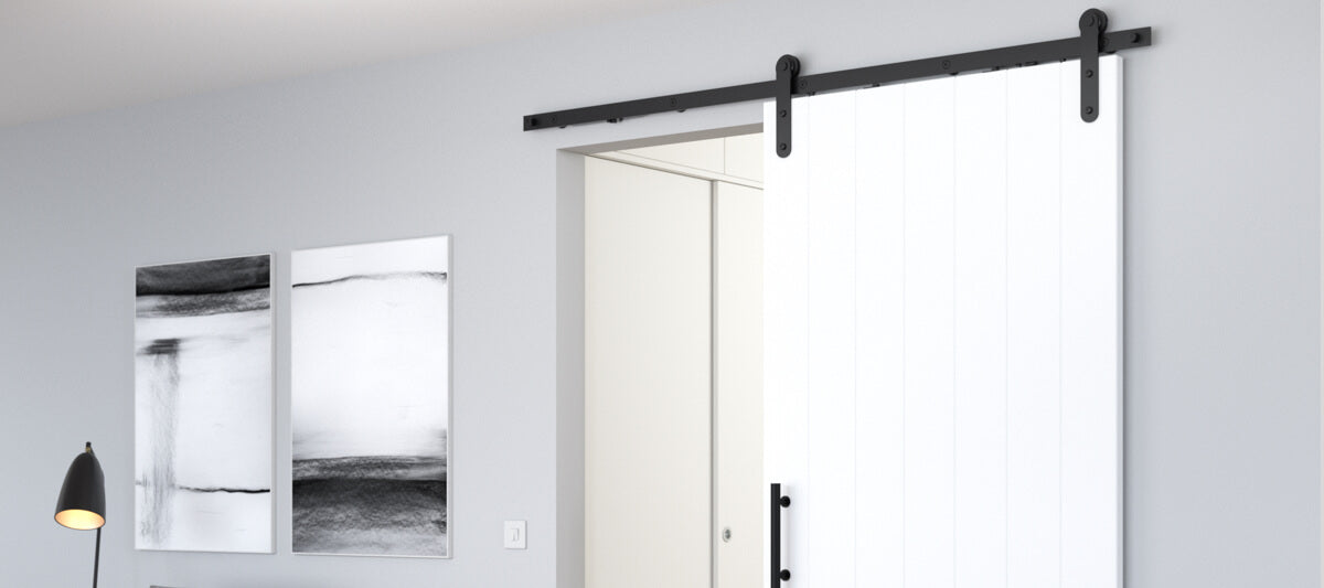 white sliding barn door for modern home with black hardware