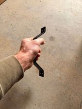 small black handle in hand
