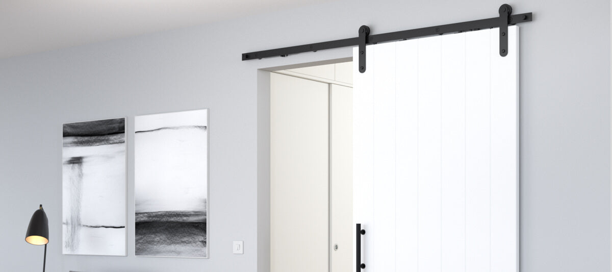 white sliding barn door for modern home with black hardware 